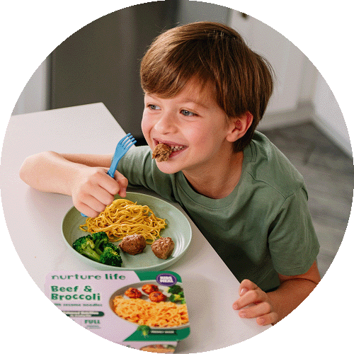 Happy child enjoying a Kids Meal